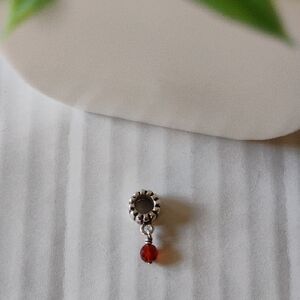 Pandora Retired Garnet Sterling Silver Dangle Charm.
